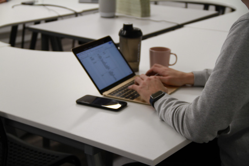 Image of a man working on a laptop